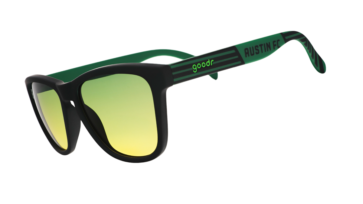 Three-quarter angle view of Austin FC Major League Soccer sunglasses with green and black frames and green-yellow lenses
