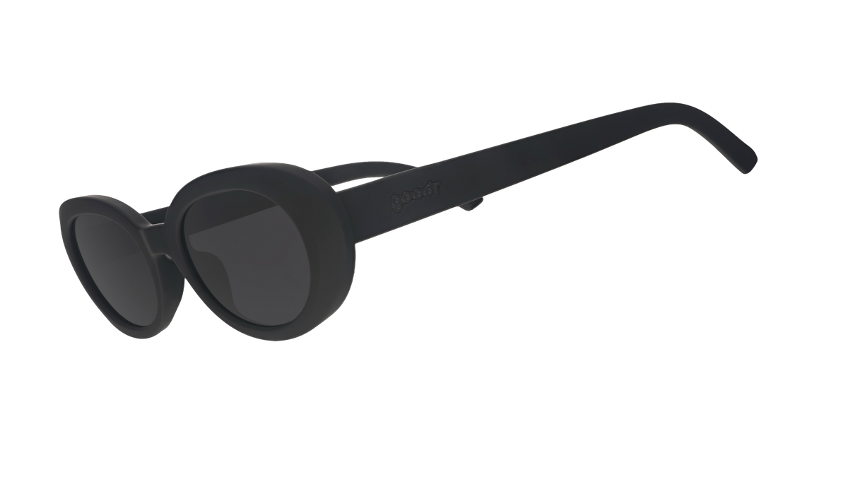 Three-quarter angle view of black oval sunglasses with polarized lenses against a white background.
