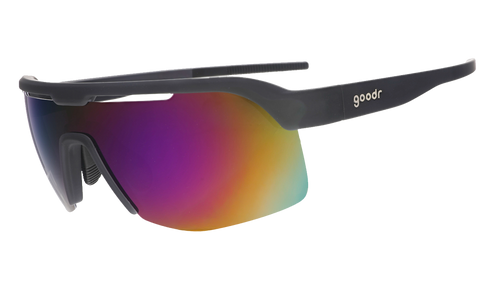 Three-quarter angle view of black shield sunnies with purple reflective wrap lenses tilted down on a white background.