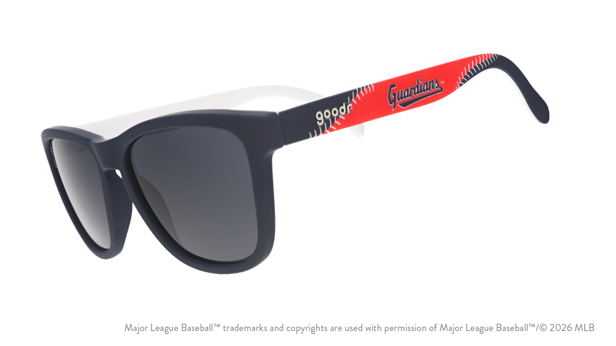Three-quarter angle view of navy, red, and white shades featuring the Guardians script logo and white baseball stitch design.