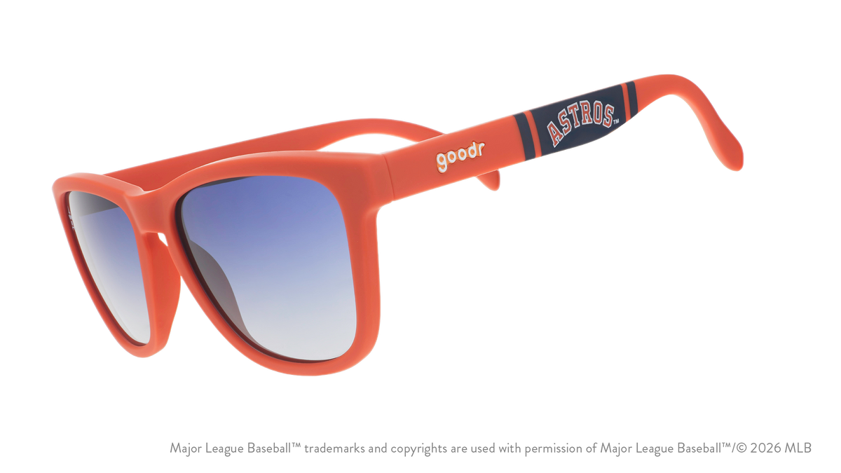 Three-quarter angle view of orange and navy Astros sunglasses featuring an Astros logo on the arm.