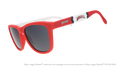 Three-quarter angle view of a pair of red, white, and blue sunglasses featuring the Angels' "halo A" logo on the arm. 