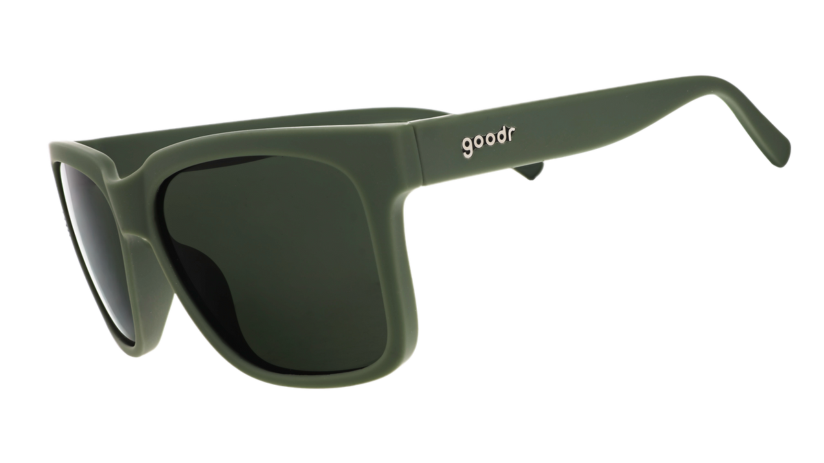 Three-quarter angle view of dark green sunglasses with green lenses designed to float in water.