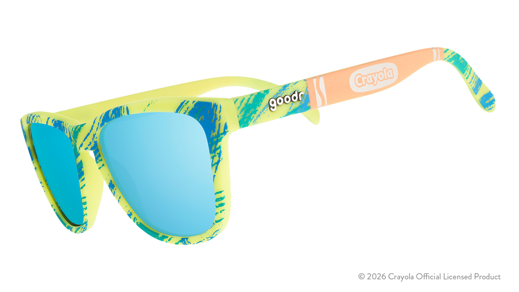 Side view of Crayola x goodr UV-activated Confetti Colors sunglasses with light blue reflective lenses.
