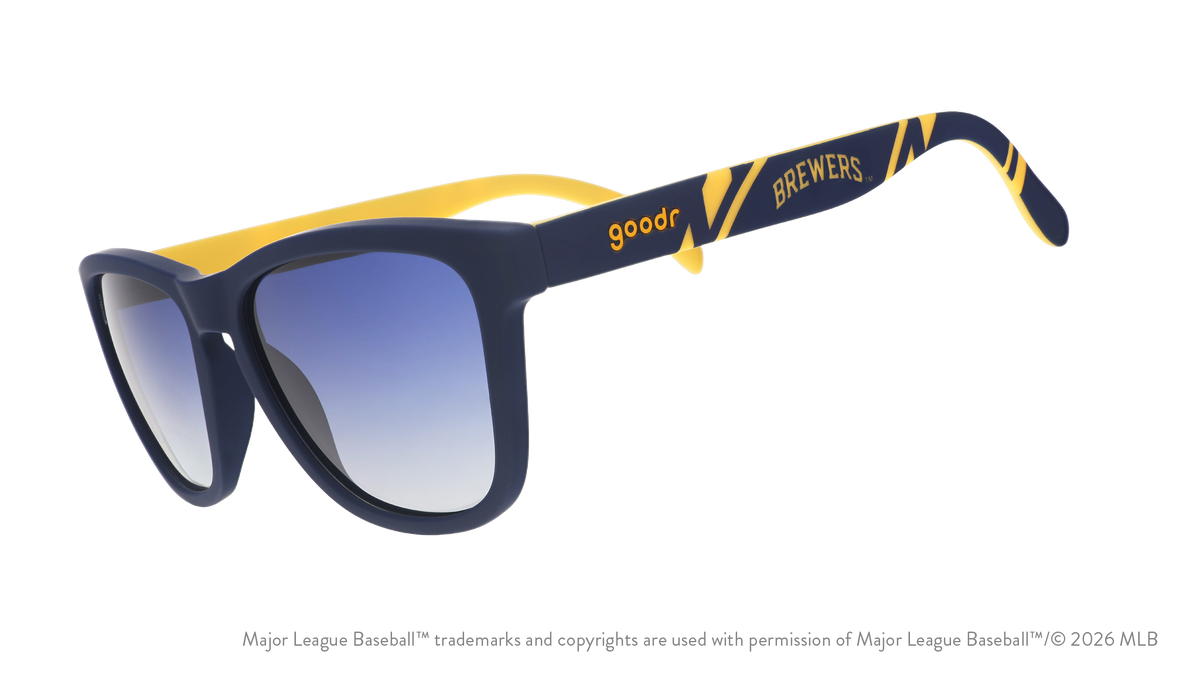 Three-quarter angle view of a pair of navy and yellow sunglasses featuring a Milwaukee Brewers logo on the arm.
