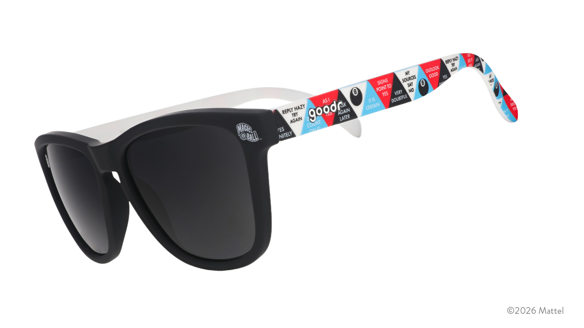 Three-quarter-angle view of black sunglasses featuring classic Magic 8 Ball responses in a multicolored design on the arms.