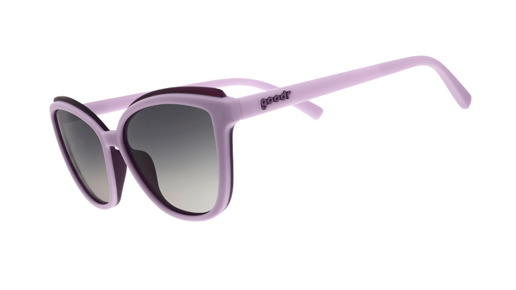 Three-quarter-angle view of lavender cat-eye Pounce G sunglasses with dark purple accents and dark gray gradient lenses.
