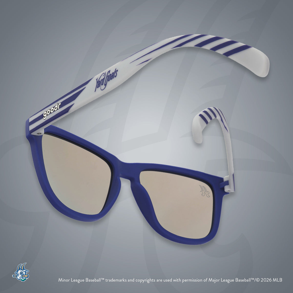 Back view of sunglasses tilted down. Blue + gray frames w/ Yard Goats on temples. Teal reflective lenses.