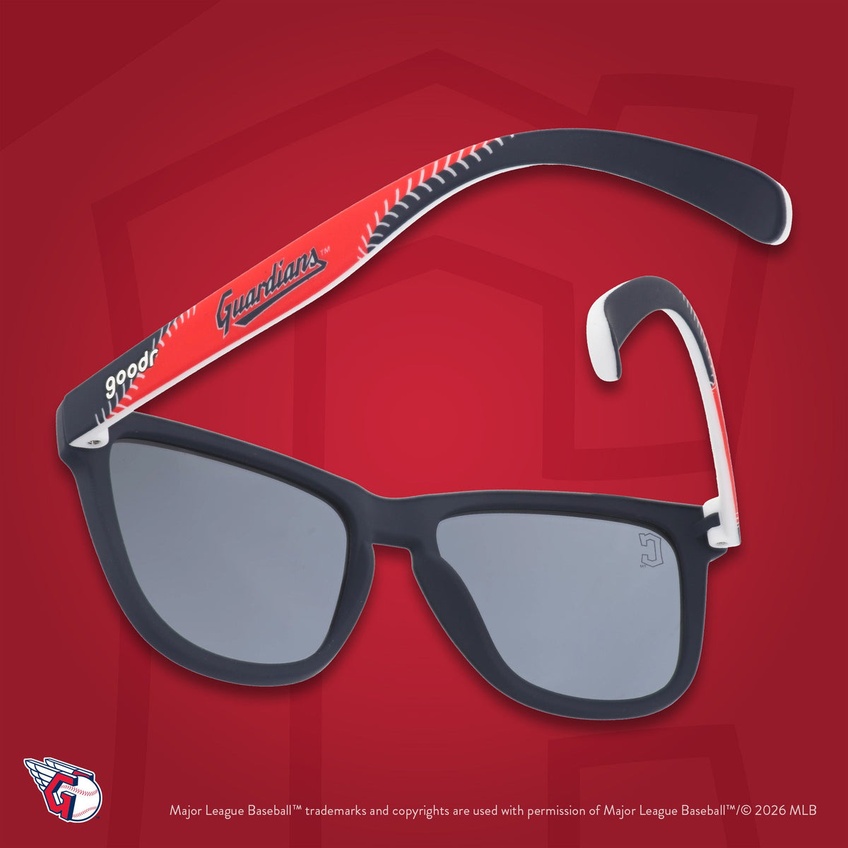 Navy, red, and white Guardians shades photographed from behind, floating against a red background featuring the C logo.