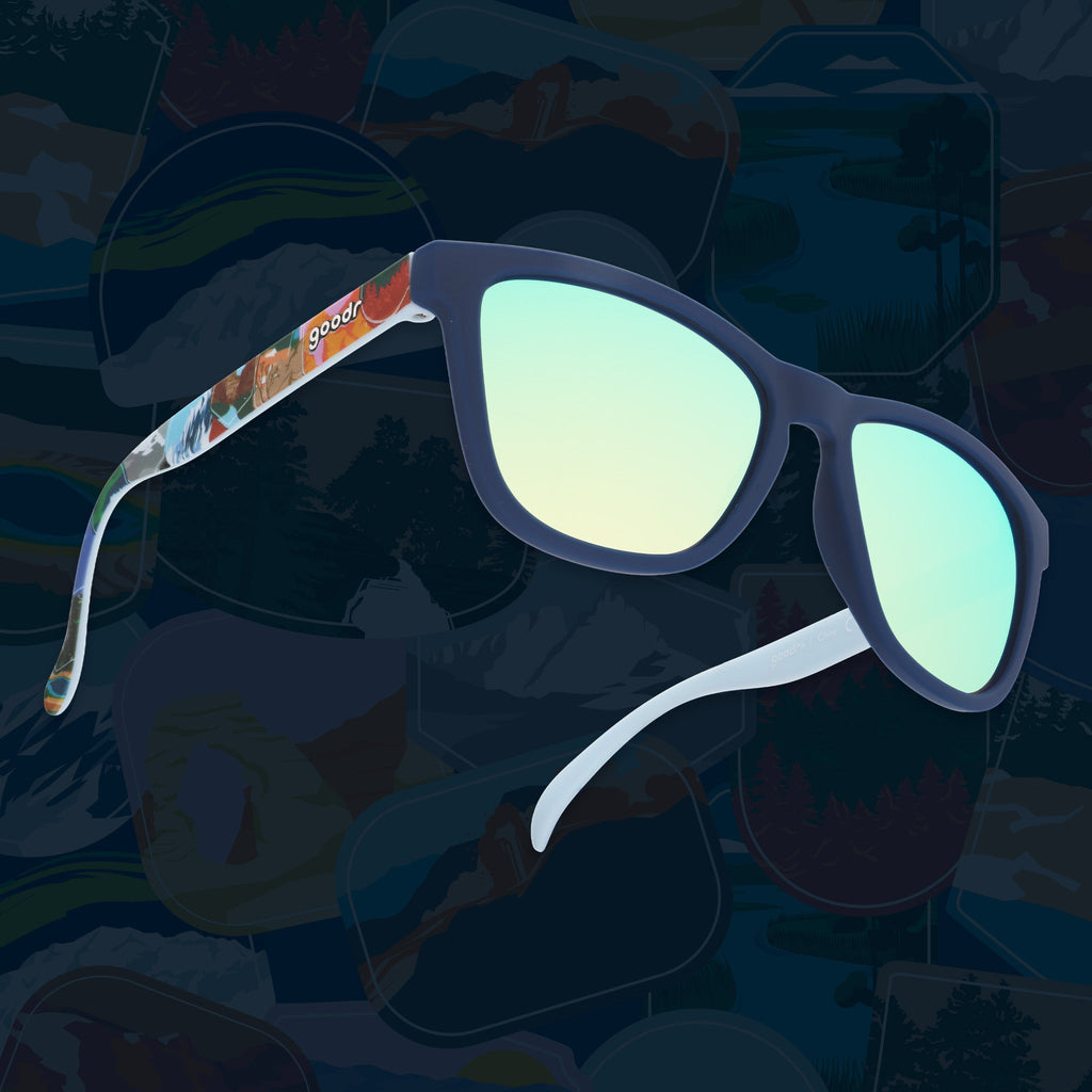Navy sunglasses with blue reflective lenses and colorful National Park Foundation temple artwork.