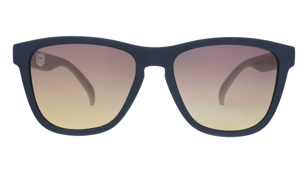 Front view of black and white sunglasses with gray-to-yellow ocean gradient lenses and the Seattle Reign logo etched into the right lens.