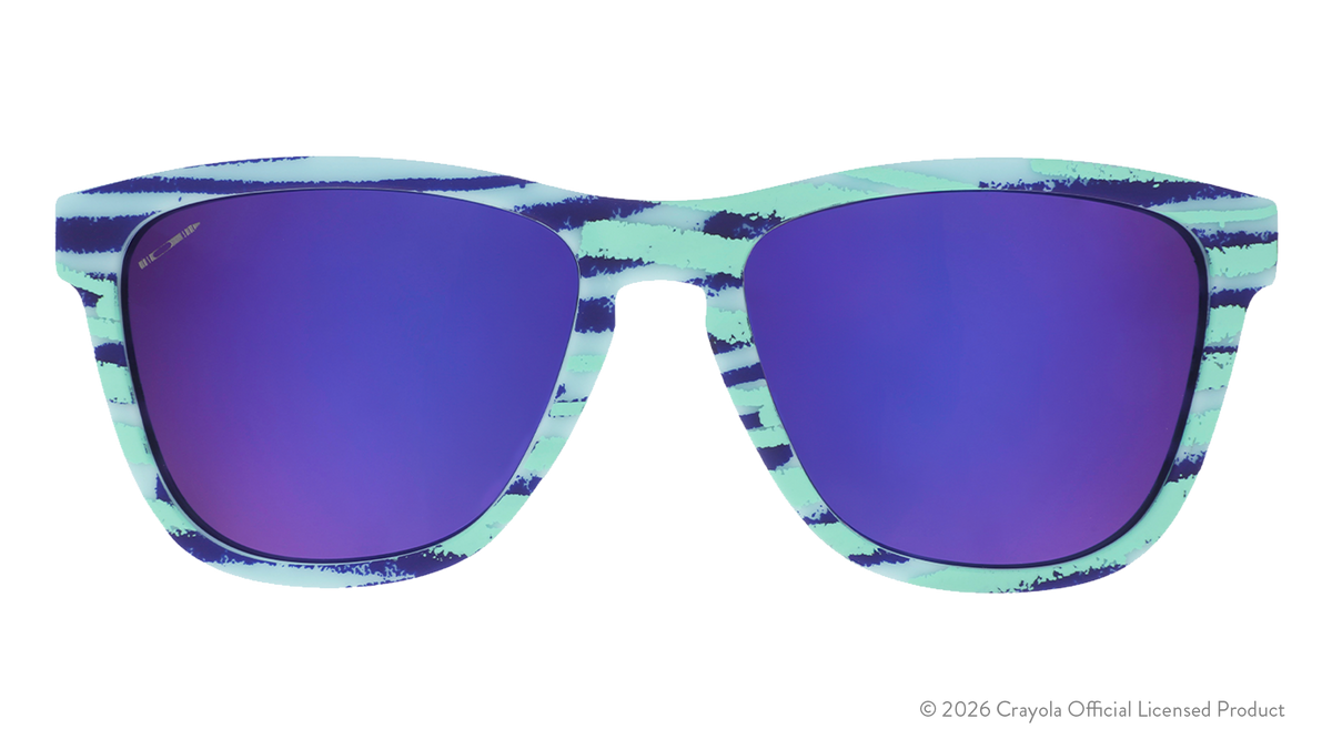 Front view of Crayola goodr UV-activated sunglasses with green and purple frames and purple reflective lenses.