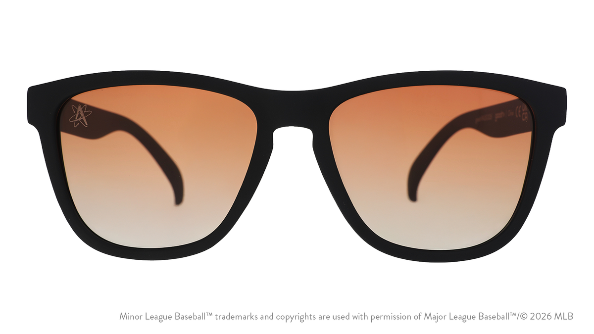 Front view of sunglasses. Black front frame. Amber reflective lenses. Isotopes logo etching in top corner of lens.