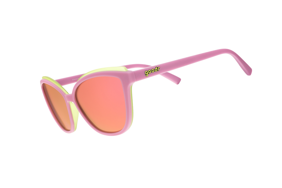 Sunglasses with pink frame and orange lenses on a white background
