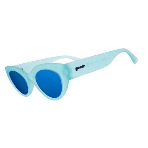 Three-quarter angle view of translucent light blue Moon G sunglasses with blue reflective lenses.