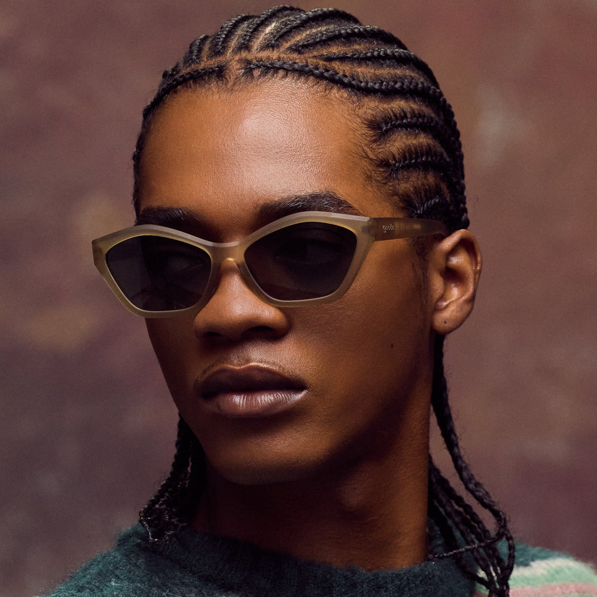 Person wearing sunglasses with a blurred background